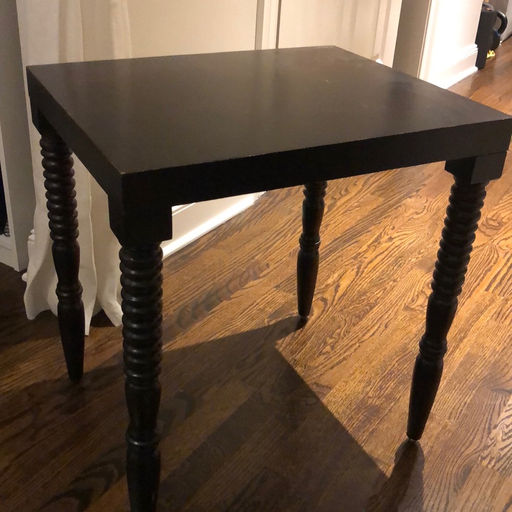 Matching black wooden side tables